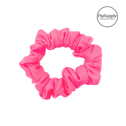 These bright pink swim scrunchies have a two layer swimsuit fabric strip with edges that are securely folded and sewn providing a professional and high quality seam. Fabric is thick high quality not coarse or stiff with elastic band sewn inside for stretch-ability. Pattern visible on all sides. 
