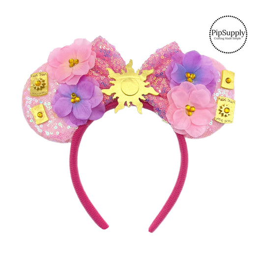These light pink mouse ear headbands are a stylish hair accessory. These comfortable headbands have attached glitter bow and mouse ears. Along with sun and floral embellishments. This hair accessory comes completely assembled and is great for park vacations, costumes or for everyday wear!