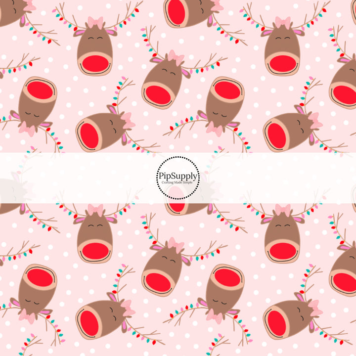 These holiday pattern themed headband kits are easy to assemble and come with everything you need to make your own knotted headband. These fun Christmas kits include a custom printed and sewn fabric strip and a coordinating velvet headband. The headband kits features reindeers with Christmas lights on light pink with small white dots.