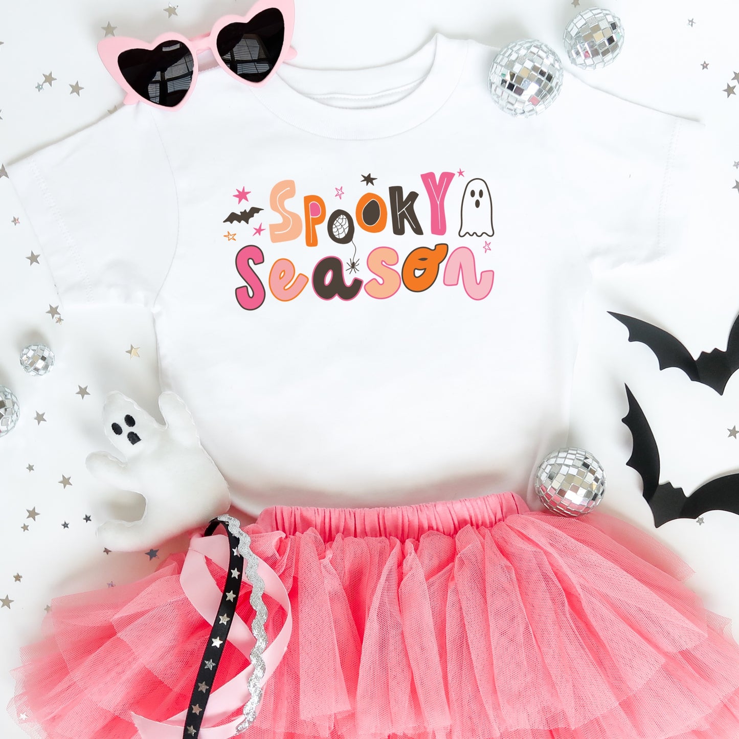 Pink and orange iron on heat transfer that says "Spooky Season".