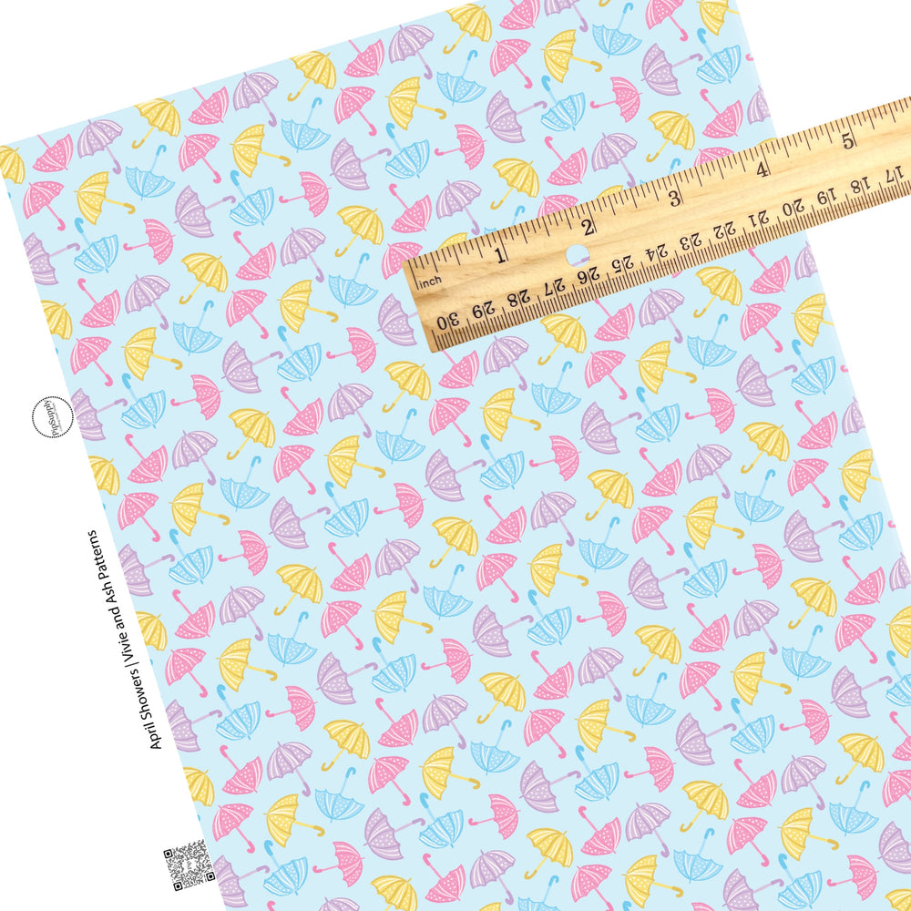 These spring faux leather sheets contain the following design elements: pastel pink, purple, yellow, and blue rain umbrellas. Our CPSIA compliant faux leather sheets or rolls can be used for all types of crafting projects.