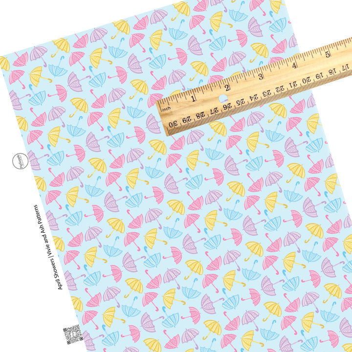 These spring faux leather sheets contain the following design elements: pastel pink, purple, yellow, and blue rain umbrellas. Our CPSIA compliant faux leather sheets or rolls can be used for all types of crafting projects.