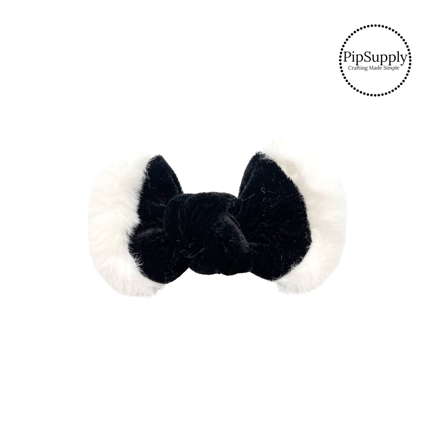 white fur on black tied hair bow