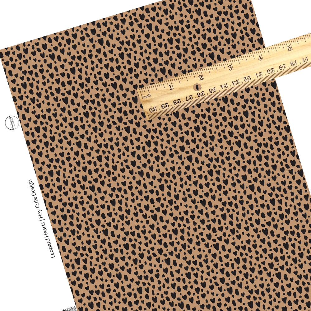 These heart and spot themed brown faux leather sheets contain the following design elements: leopard pattern with hearts and spots in black on brown. Our CPSIA compliant faux leather sheets or rolls can be used for all types of crafting projects.