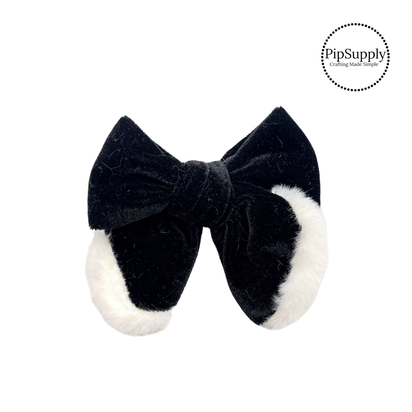 white fur on black tied hair bow