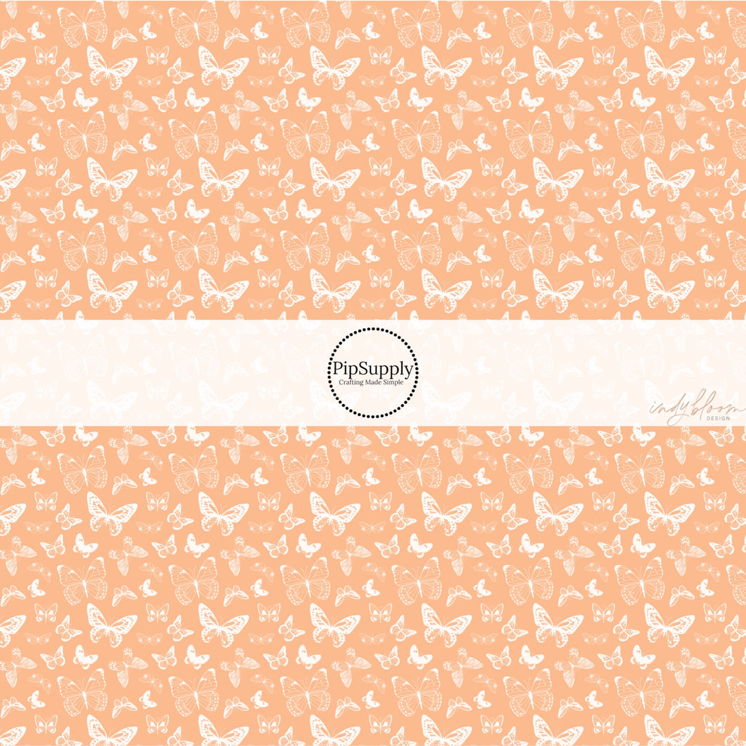 These spring fabric by the yard features boho butterflies on peach. This fun pattern fabric can be used for all your sewing and crafting needs!