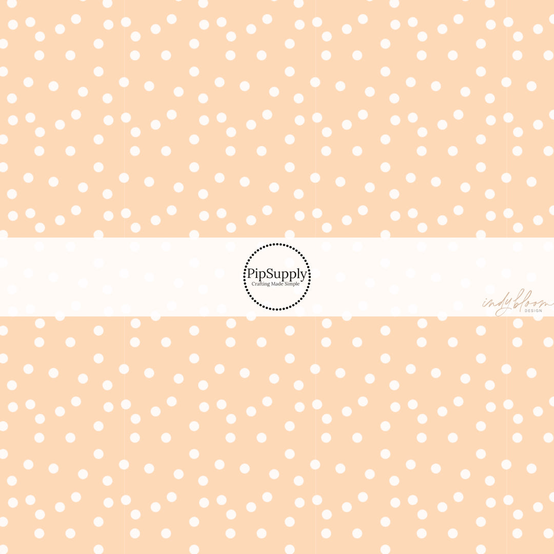 These spring fabric by the yard features boho dots on peach. This fun pattern fabric can be used for all your sewing and crafting needs!