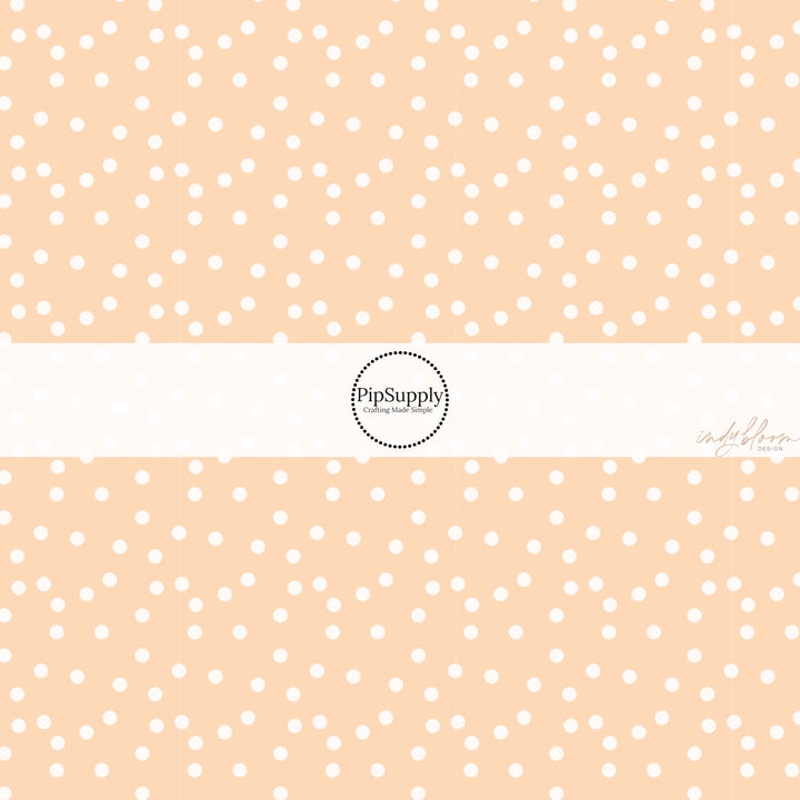 These spring fabric by the yard features boho dots on peach. This fun pattern fabric can be used for all your sewing and crafting needs!