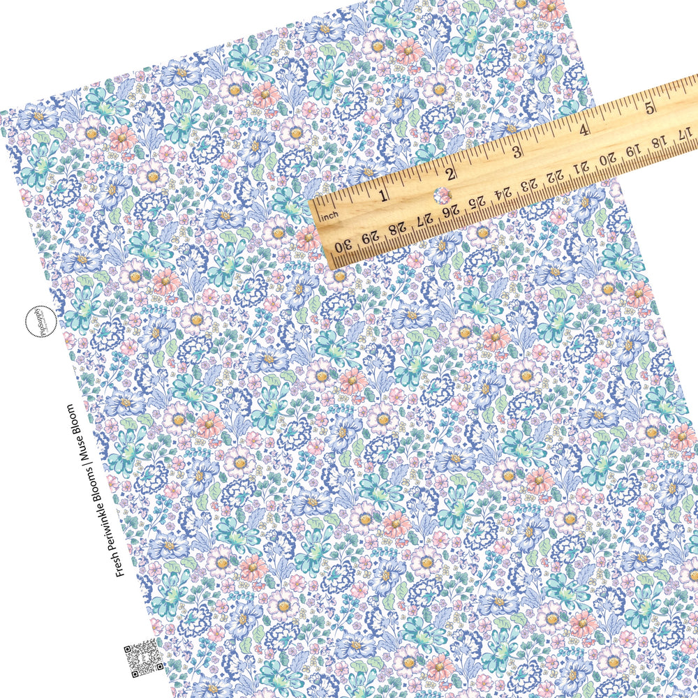 These floral themed cream faux leather sheets contain the following design elements: navy blue, light blue, teal, cream, light pink, yellow, and aqua flowers on cream.