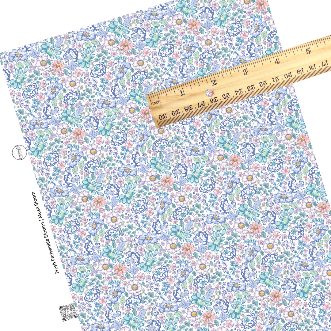 These floral themed cream faux leather sheets contain the following design elements: navy blue, light blue, teal, cream, light pink, yellow, and aqua flowers on cream.