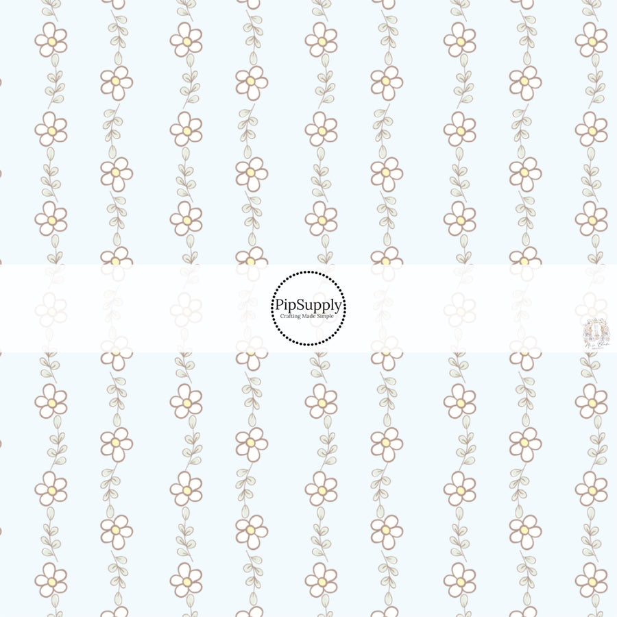 This spring floral fabric by the yard features tiny daisies on light blue. This seasonal pattern fabric can be used for all your sewing and crafting needs!