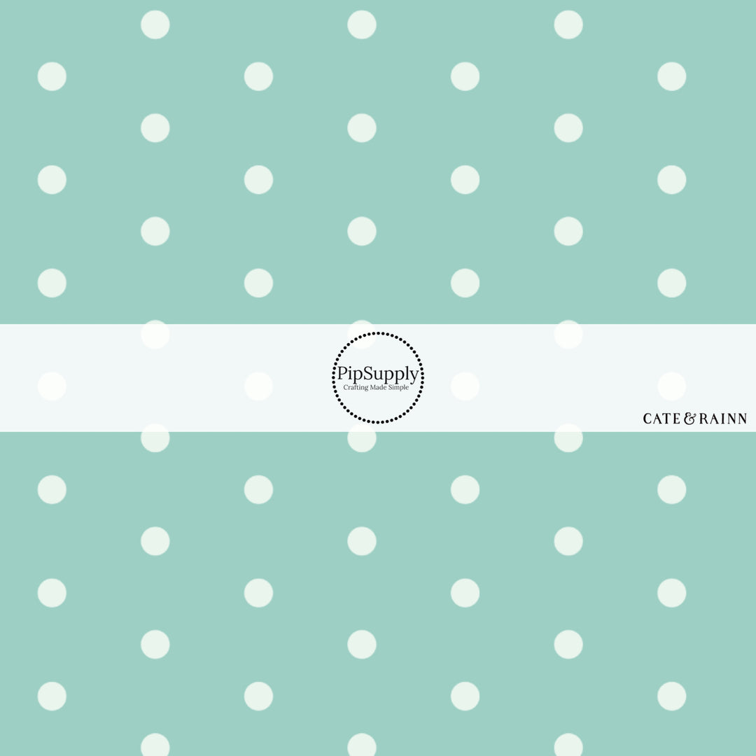 These dot fabric by the yard features aqua dots pattern. This fun pattern fabric can be used for all your sewing and crafting needs!