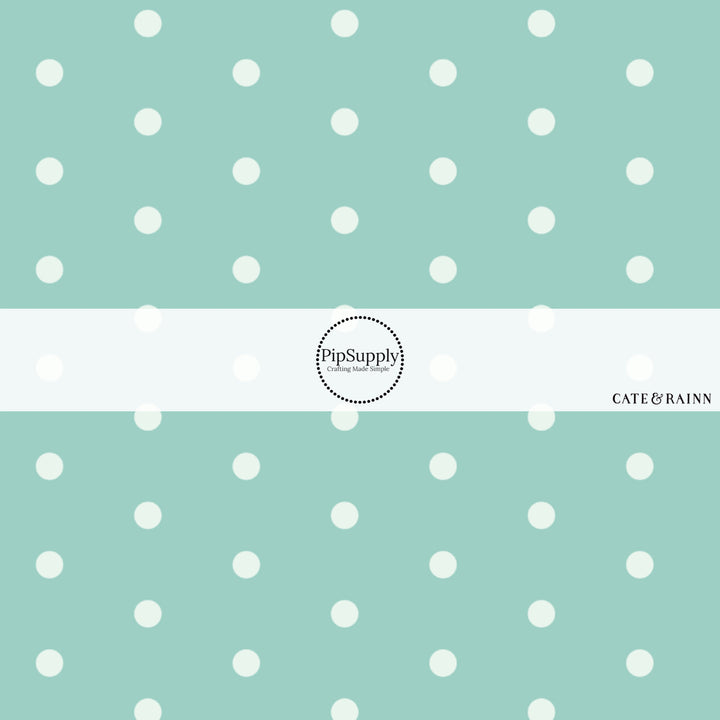 These dot fabric by the yard features aqua dots pattern. This fun pattern fabric can be used for all your sewing and crafting needs!