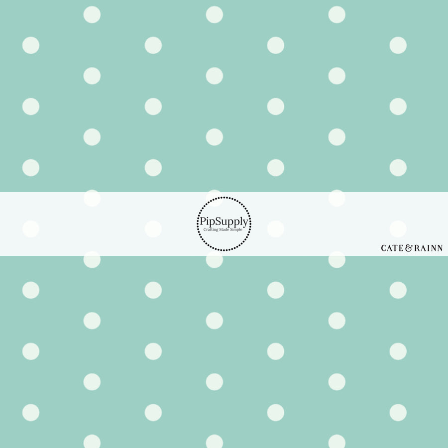 These dot fabric by the yard features aqua dots pattern. This fun pattern fabric can be used for all your sewing and crafting needs!