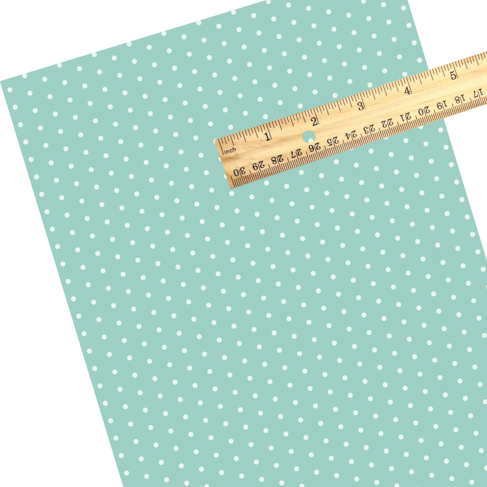 These dot themed faux leather sheets contain the following design elements: aqua dots pattern. Our CPSIA compliant faux leather sheets or rolls can be used for all types of crafting projects.