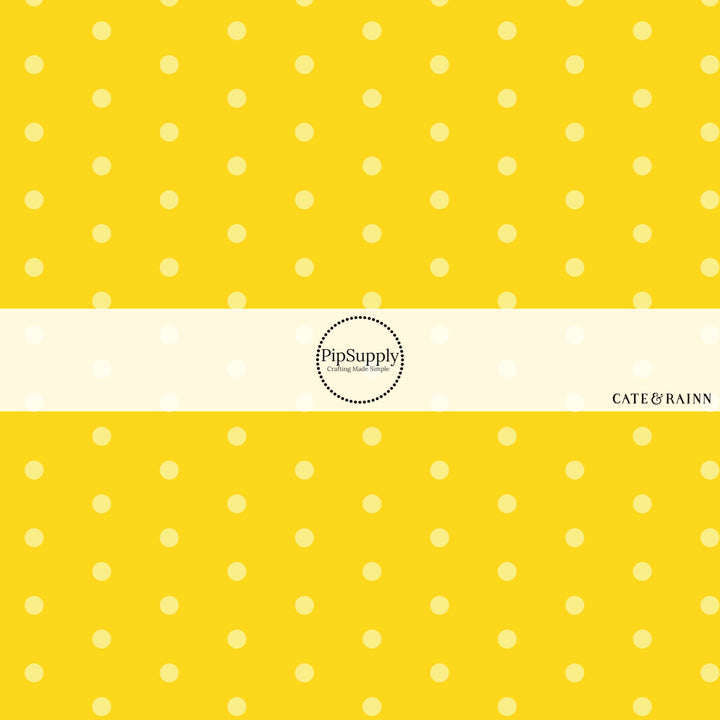 These dot fabric by the yard features yellow dots pattern. This fun pattern fabric can be used for all your sewing and crafting needs!