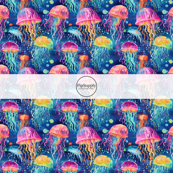 These tropical ocean themed fabric by the yard features glowing jelly fish. This fun pattern fabric can be used for all your sewing and crafting needs!