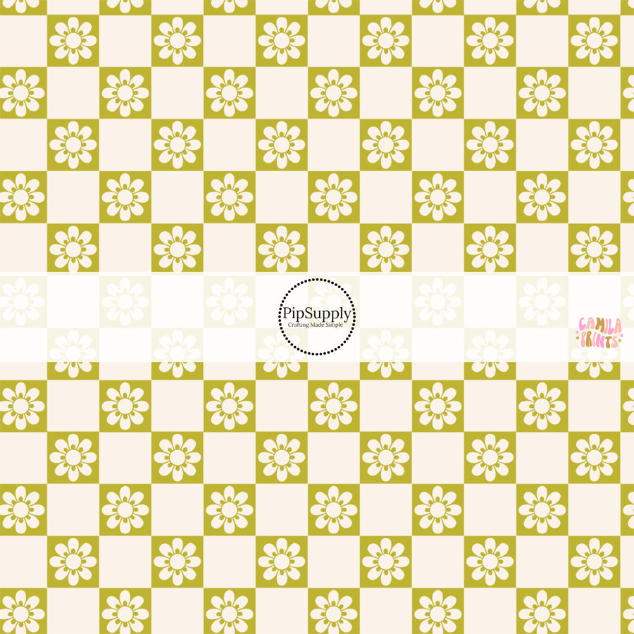 This spring fabric by the yard features daisy flowers on green and cream checkers. This fun pattern fabric can be used for all your sewing and crafting needs!
