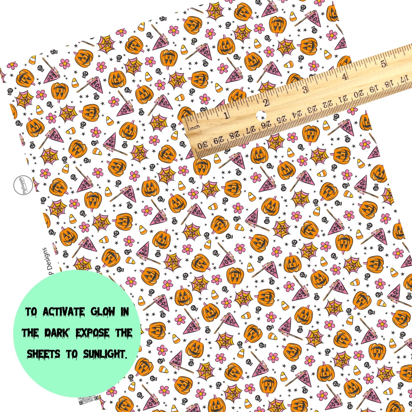 Scattered halloween celebration on white faux leather sheets