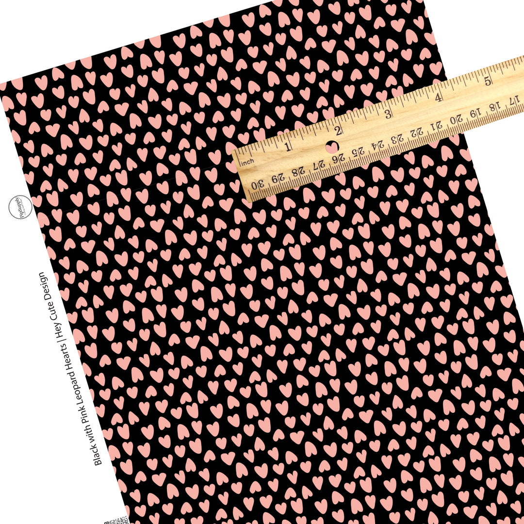 These heart and spot themed black faux leather sheets contain the following design elements: leopard pattern with hearts and spots in pink on black. Our CPSIA compliant faux leather sheets or rolls can be used for all types of crafting projects.