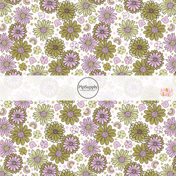 This holiday fabric by the yard features green and purple flowers. This festive pattern fabric can be used for all your sewing and crafting needs!