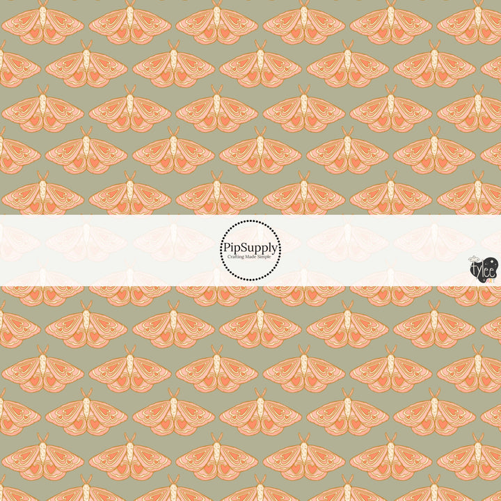 This holiday fabric by the yard features moths on sage. This festive pattern fabric can be used for all your sewing and crafting needs!