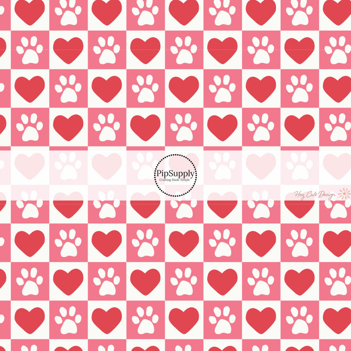 This holiday fabric by the yard features red hearts and dog paws on pink and cream checkers. This festive pattern fabric can be used for all your sewing and crafting needs!