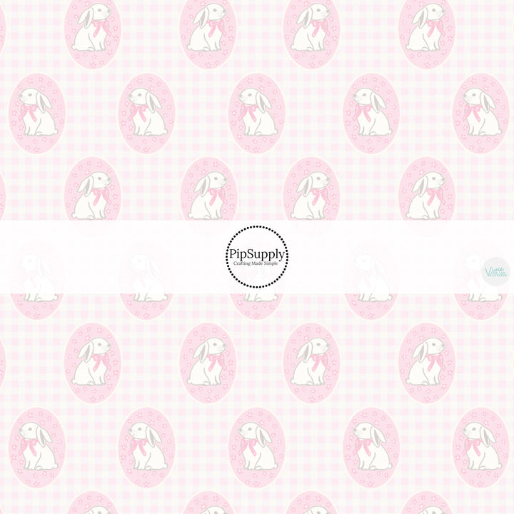 This Easter themed fabric by the yard features Easter bunnies in pink circles on a light pink plaid pattern. This fun pattern fabric can be used for all your sewing and crafting needs!