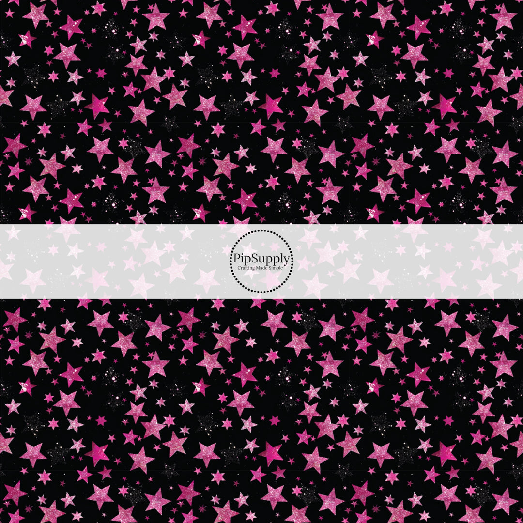 This holiday fabric by the yard features pink stars on black. This festive pattern fabric can be used for all your sewing and crafting needs!