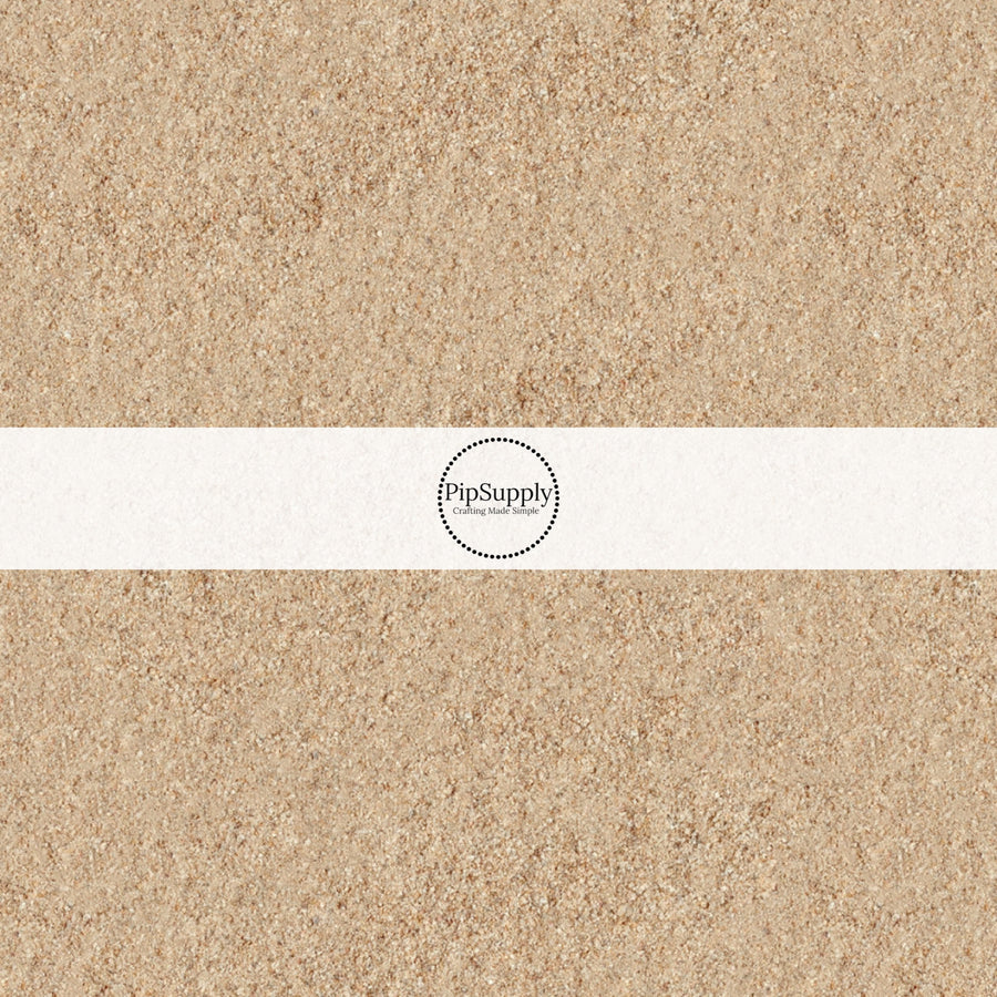 These beach themed fabric by the yard features beach sand. This fun pattern fabric can be used for all your sewing and crafting needs!