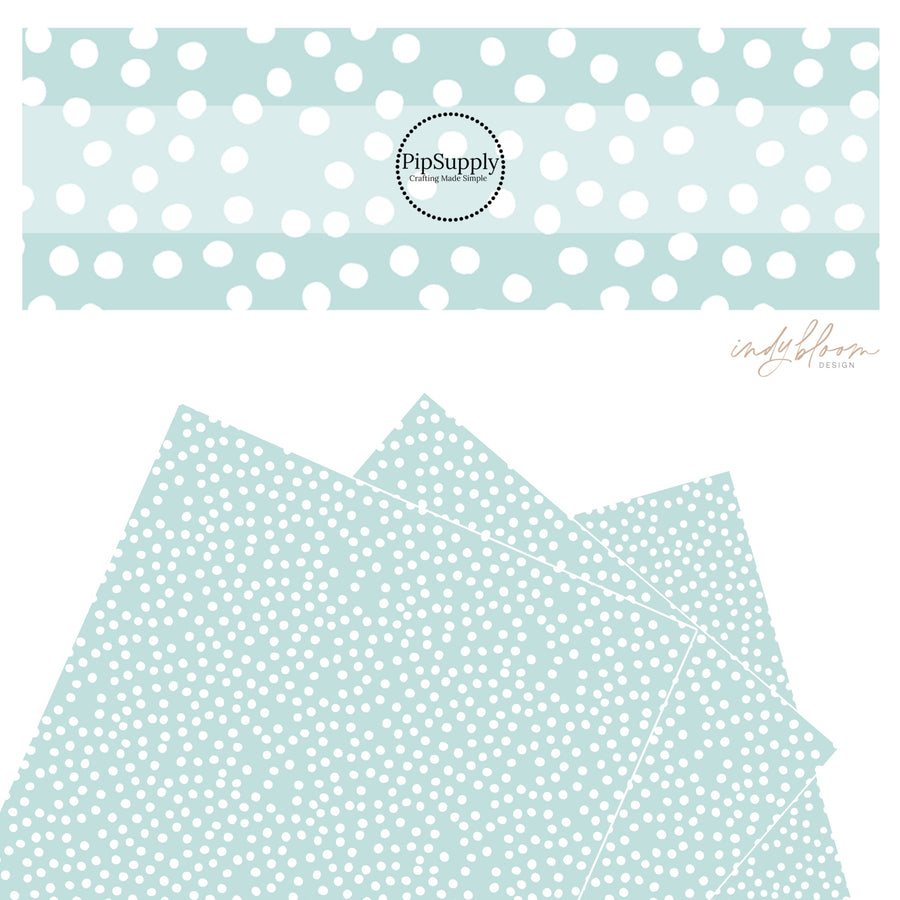These small dots on a light teal faux leather sheets contain the following design elements: small dots in white scattered on a teal blue background.
