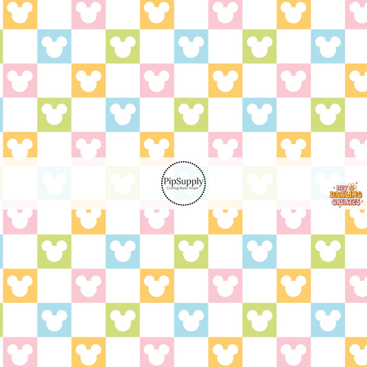 This magical inspired fabric by the yard features the following design: multi colored checker pattern with mouse ears on cream. This fun themed fabric can be used for all your sewing and crafting needs!