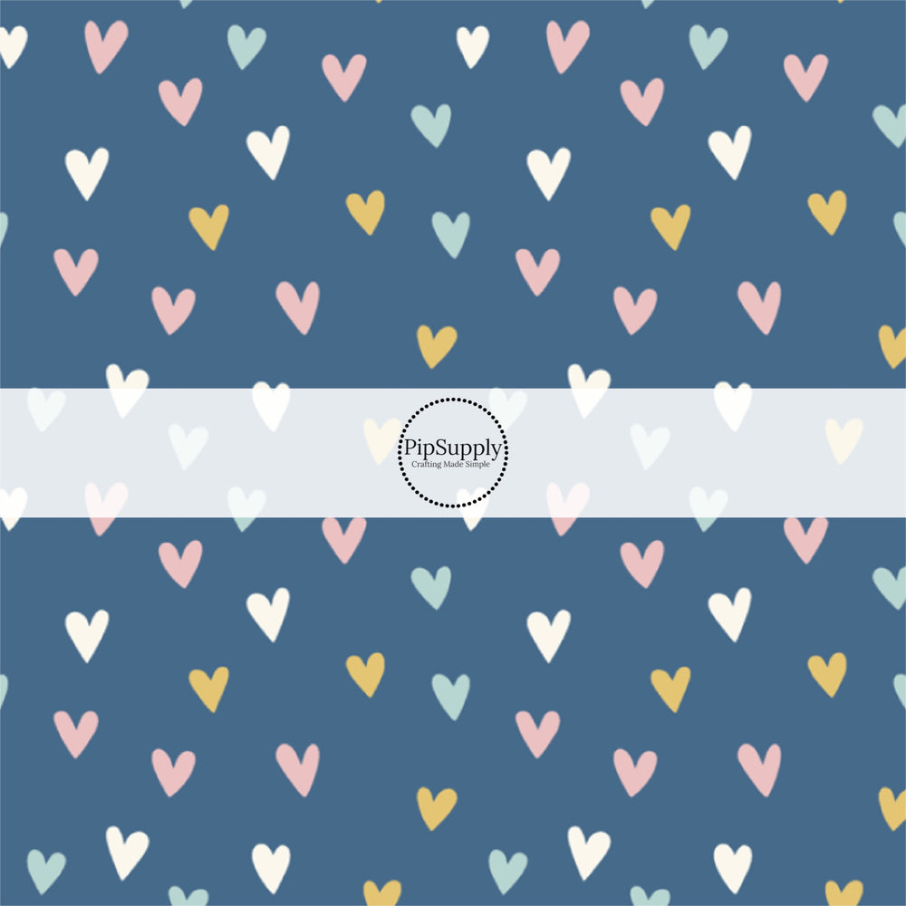 These spring pattern themed no sew bow strips can be easily tied and attached to a clip for a finished hair bow. These patterned bow strips are great for personal use or to sell. These bow strips features light pink, light blue, yellow, and cream hearts on dark blue.