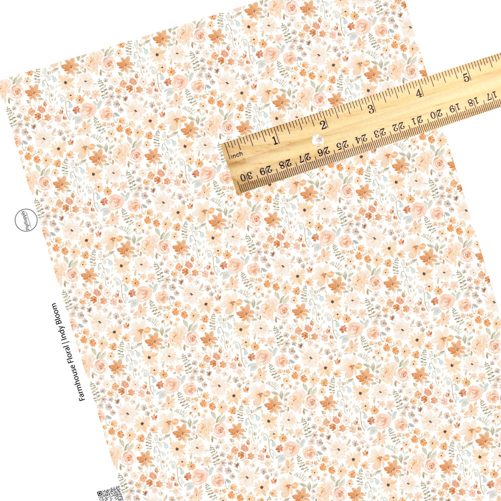 These neutral watercolor flowers on white faux leather sheets contain the following design elements: flowers in the colors of light pink, peach, light blue, olive, tan, and cream.