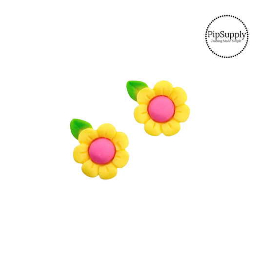 Green leaves on yellow sunflower with pink center flat back resin embellishment
