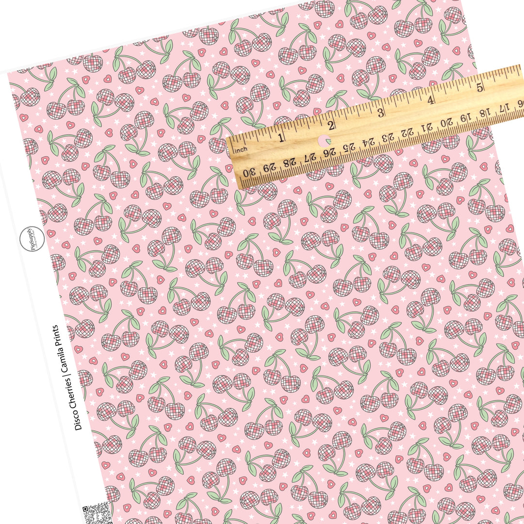 Pink hearts with disco cherries on pink faux leather sheets