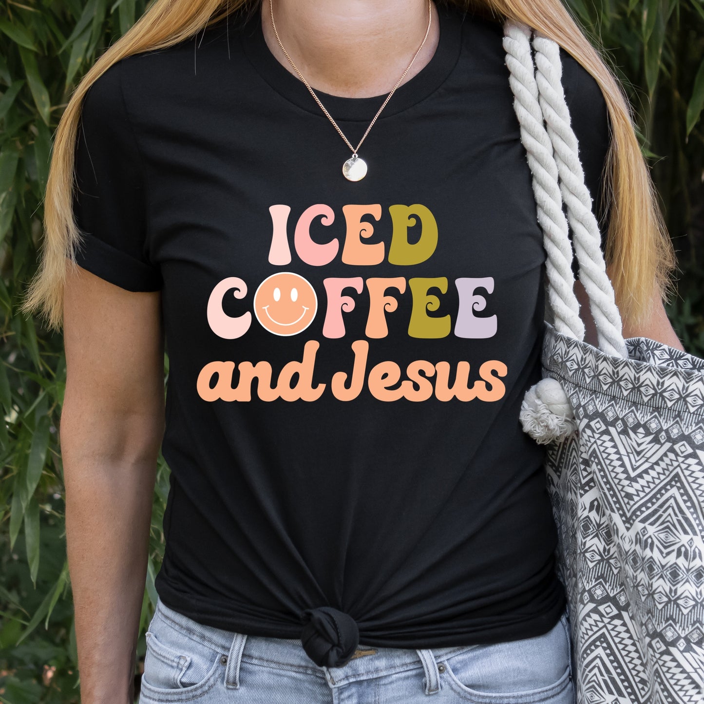 Black T Shirt with a graphic iron-on that says "Iced Coffee and Jesus" Iron Transfers