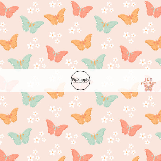 Light Pink fabric by the yard with white flowers, orange, pink, and blue butterflies