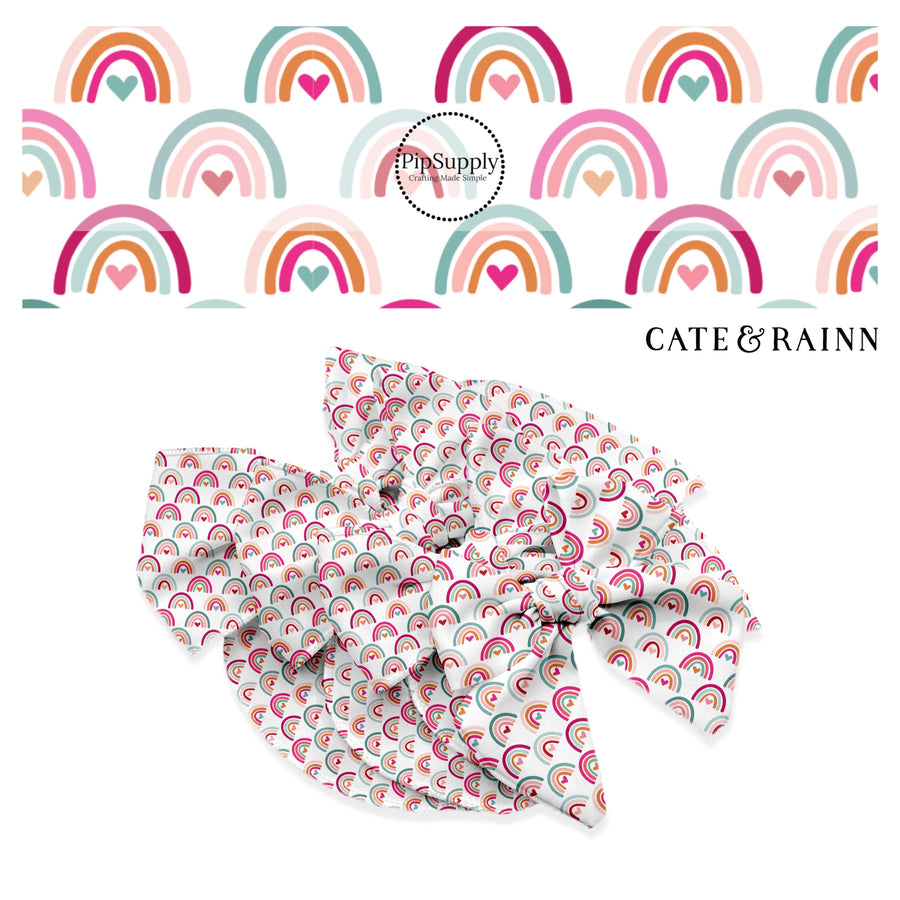 Light pink, light blue, teal, hot pink, and orange rainbows with hearts the same colors on white bow strips