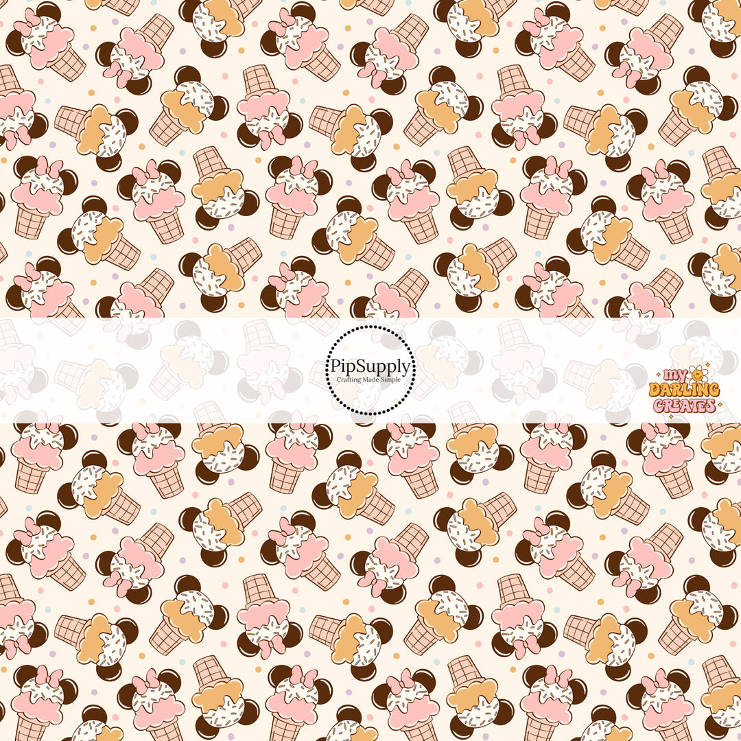 Sprinkled ice cream cones with mouse ears on white polka-dotted fabric by the yard.