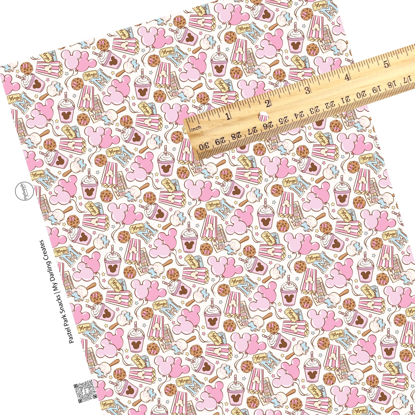Mouse park tickets, mouse balloons, ice cream, milkshakes, and popcorn on pastel faux leather sheets