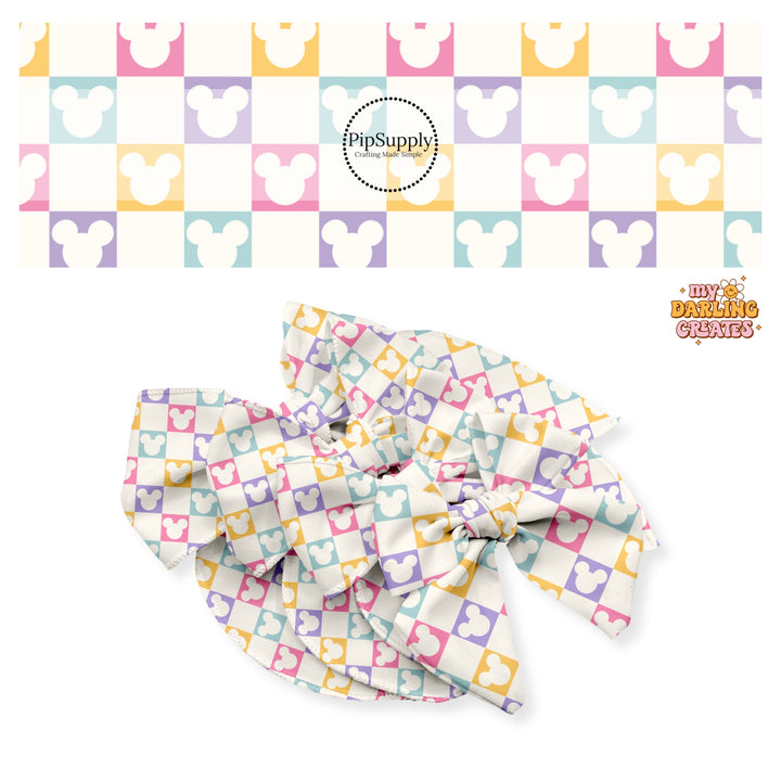 Pastel pink, yellow, purple, and aqua mouse head cutout on cream checkered bow strips