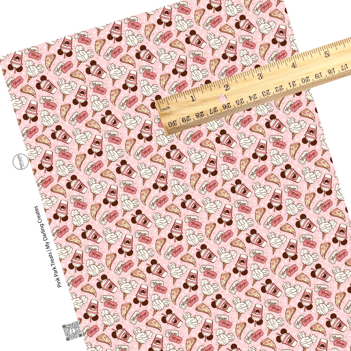 Pizza, mouse ice cream, milkshake, magic tickets on light pink faux leather sheets