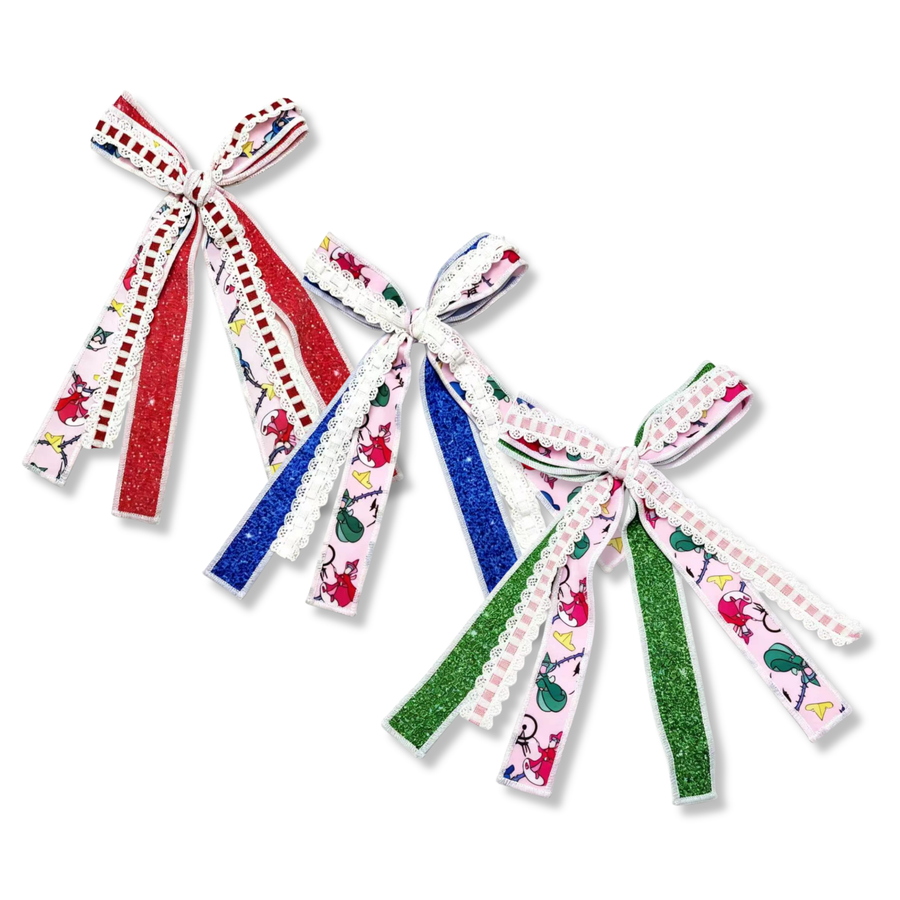 These whimsical ribbon bows feature a playful pink character-inspired print layered with sparkling glitter ribbon and delicate lace trim. Available in coordinating red, royal blue, and green colorways, each bow combines vibrant glitter tails with charming character motifs, creating a fun and festive look. The layered ribbons and soft lace accents add texture and dimension, making these bows perfect for themed outfits, park trips, and birthdays.Bow Sizing 4" x 8"
