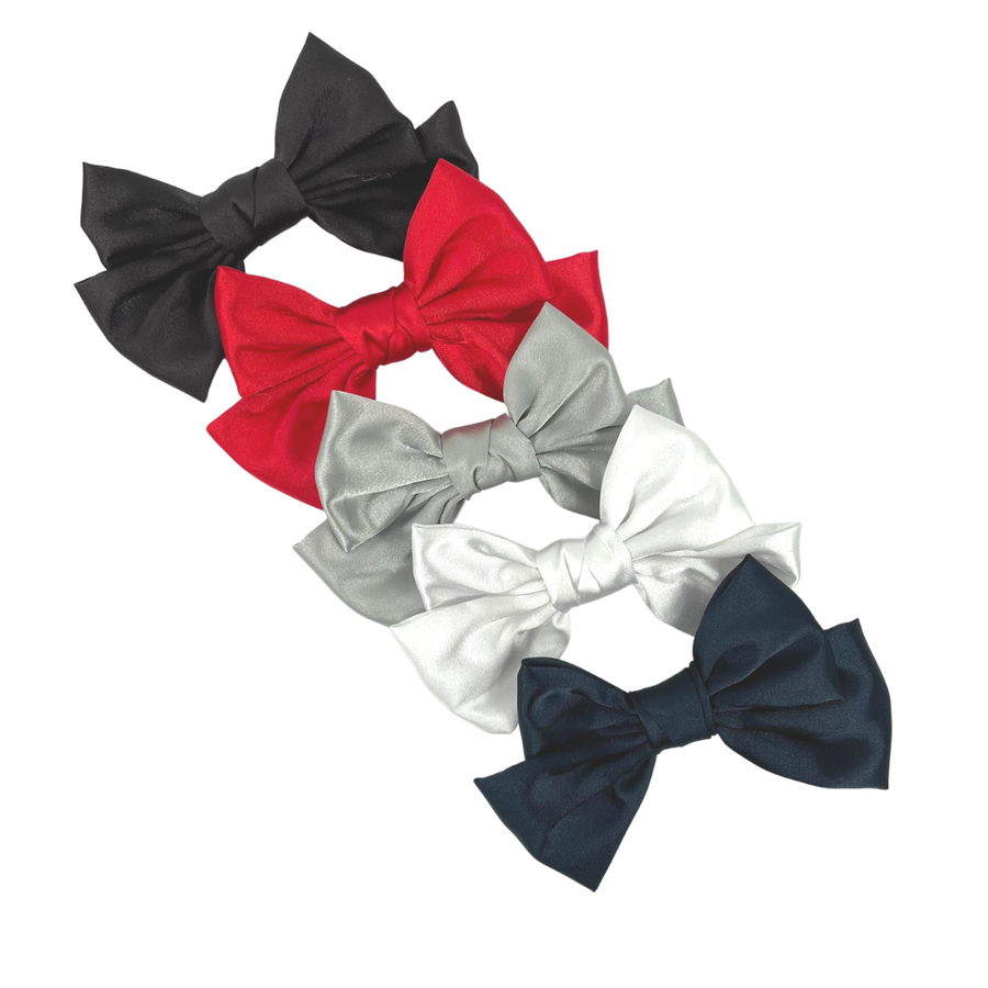 Classic Bows are the sweetest on trend hair accessory! Make matching sets using these headbands, paired with creations made using our custom printed vegan leather and glitter! The bows are satin and have a barrette attached.