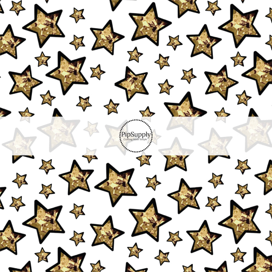 This holiday fabric by the yard features gold foil stars. This festive pattern fabric can be used for all your sewing and crafting needs!