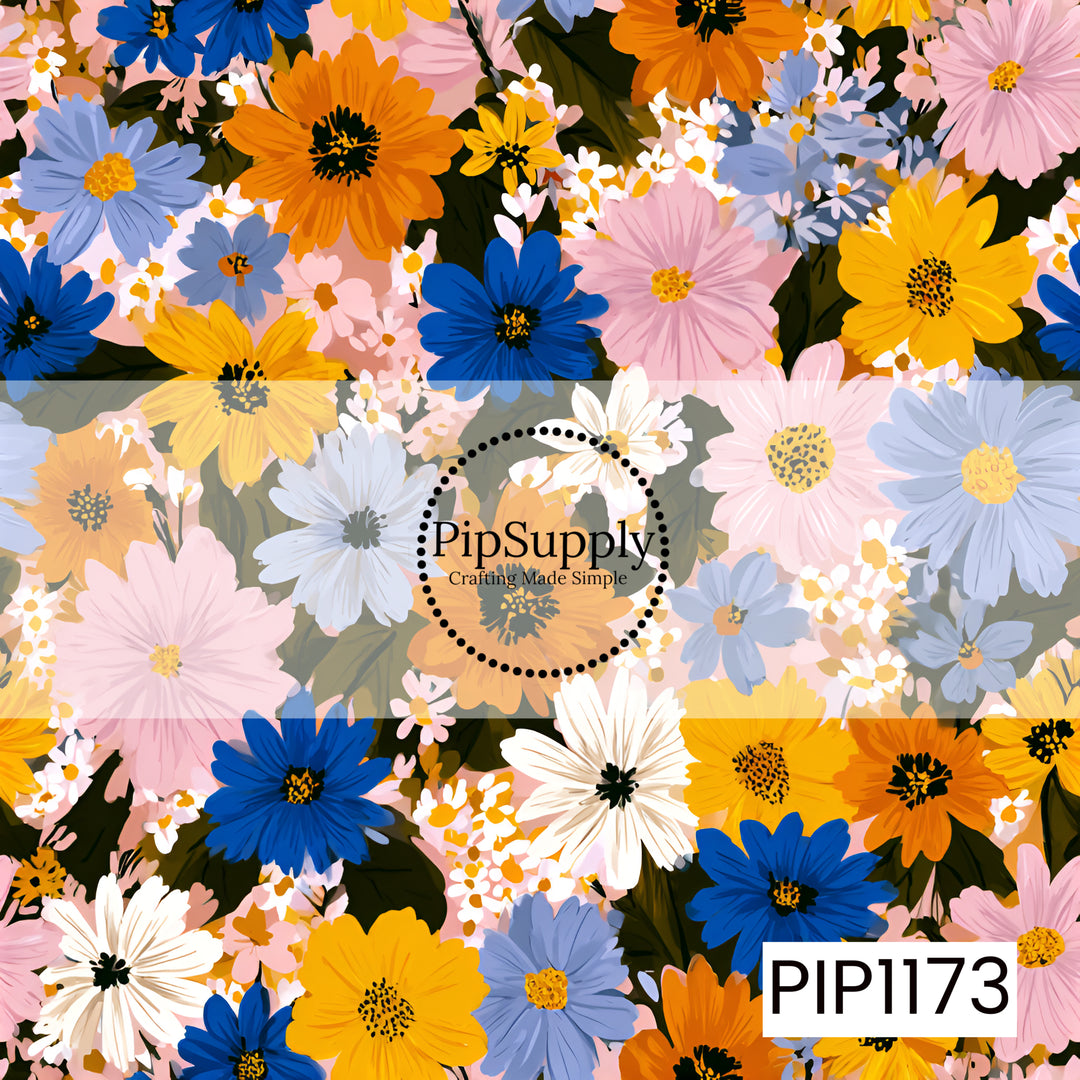 A vibrant wildflower pattern bursting with bold cobalt blue, golden yellow, orange, blush pink, soft periwinkle, and crisp white blooms layered over deep green foliage.

