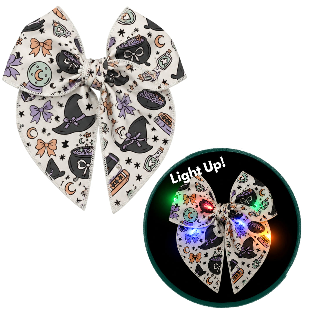 Spells & Sparkles Light Up Bow W/ Clip