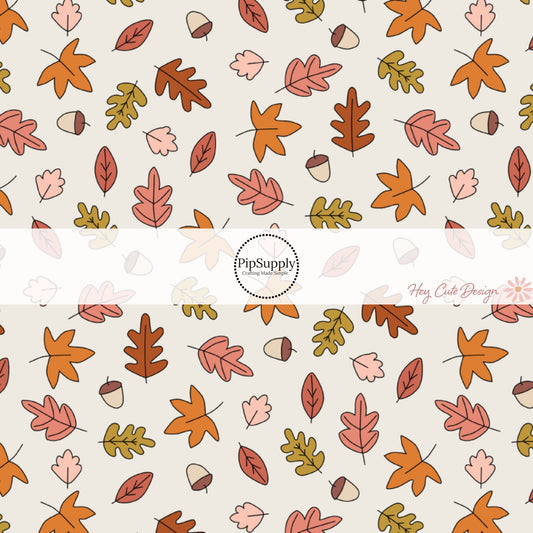 These fall themed cream fabric by the yard features fall leaves and acorns on cream. This fun fall themed fabric can be used for all your sewing and crafting needs! 