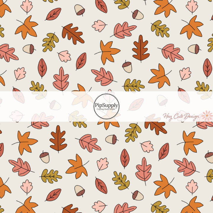 These fall themed cream fabric by the yard features fall leaves and acorns on cream. This fun fall themed fabric can be used for all your sewing and crafting needs! 